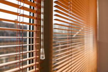 Modern blinds hanging on window