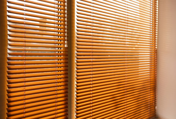 Modern blinds hanging on window