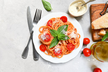 pasta spaghetti with tomatoes and basil.  traditional dish of Italian cuisine. pasta recipe