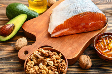 Healthy products rich in omega-3 on wooden background