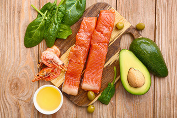 Healthy products rich in omega-3 on wooden background
