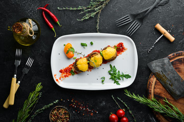 Baked mushrooms with cheese and vegetables. Restaurant dishes. Top view. Free copy space.