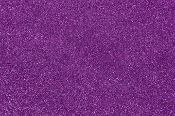 Blurred abstract shiny purple background. Glitter violet texture with copy space.