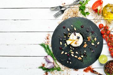 Camembert grilled cheese with honey and nuts. Top view. free space for your text. Rustic style.