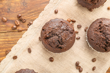 Tasty chocolate muffins on table
