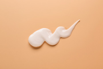 Sample of cream on color background