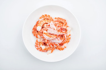 A plate of shrimp with open back and shrimp line