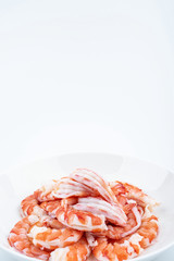 A plate of shrimp with open back and shrimp line