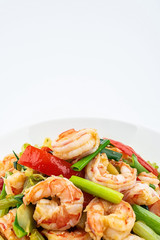 Stir-fried shrimp with celery in a dish on white background