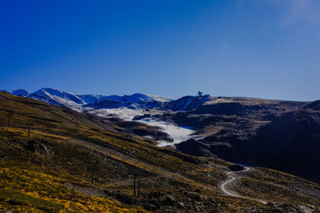 Beautiful landscape snow covered mountains and blue sky