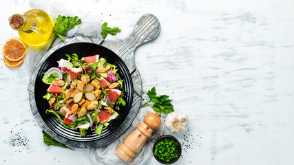 Salad with mussels, grapefruit and vegetables. Top view. Free space for your text.