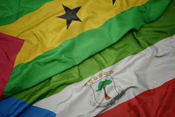 waving colorful flag of equatorial guinea and national flag of sao tome and principe .