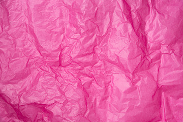 abstract background pink crumpled transparent paper on white paper.