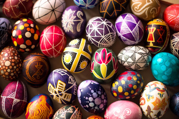 Fototapeta na wymiar Background with Easter hand-painted eggs in a folk style. Easter holiday.