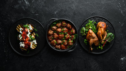 Set of dishes and food. Caviar, quail, meat balls. Flat lay. Top view. Free copy space.