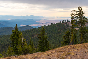 Forests, lake and storm clouds seen from Crater Lake