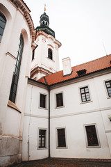 Strahov Monastery old white building facade in Prague, Czech Republic