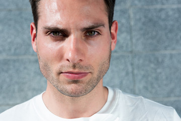 Fototapeta premium Close up face serious handsome young man