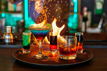 many drinks, burning, cocktail with lime, alcohol, bar