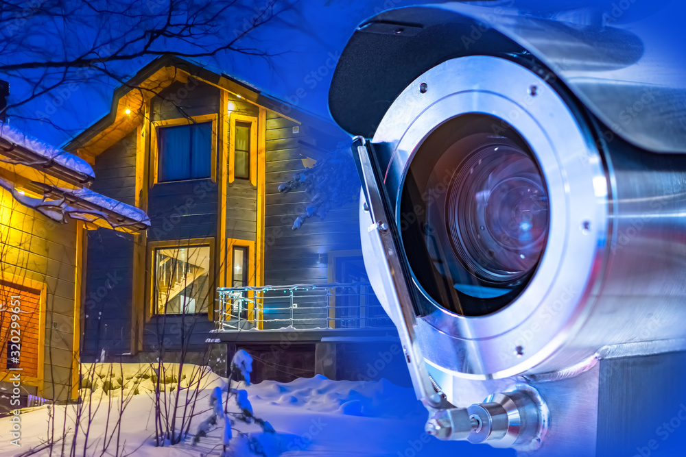 Poster vandal-proof camera on the cottage. 24-hour video surveillance system for the territory. security me