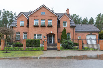 City Bergi, Latvia. Living house and street. Windows and garden.