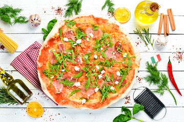 Pizza with prosciutto and cheese. Top view. Free copy space.