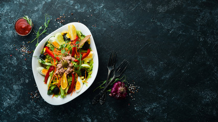 Tuna salad. Tuna, cucumber, tomatoes, cheese, eggs. Top view. Free copy space.