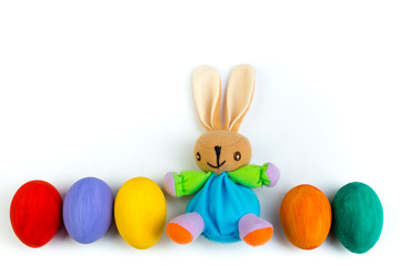 Happy Easter. Colorful easter eggs and rabbit on isolated white background.