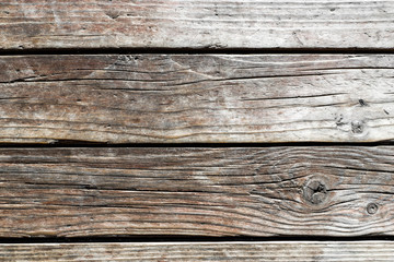 Texture of old weathered wooden planks. Cracks in wall of rural house. Free text space.