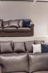 Stack of leather sofas and couches at furniture and home furnishing store in America