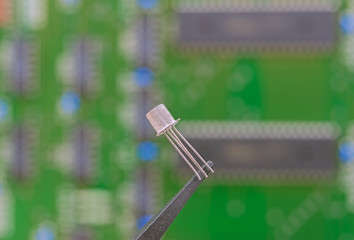 Electronic component held with tweezers