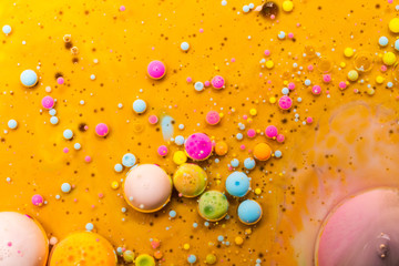 Macro universe, platnets and stars in it, multi-colored paints.