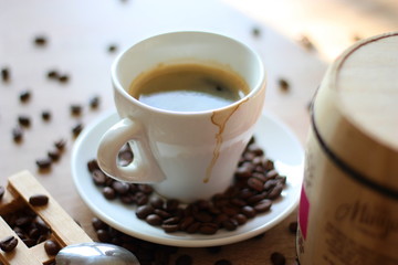 A cup of coffee and coffee beans