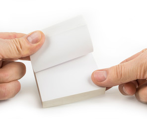 Block of paper notes hold with fingers