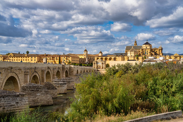 Naklejka na ściany i meble Mosque-Cathedral and the Roman Bridge in Cordoba, Andalusia, Spain