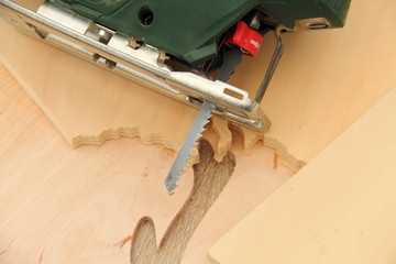 a jigsaw with sawn wood