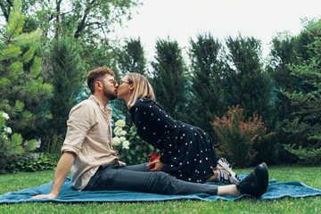 Young couple in love taking a selfie with an instant camera