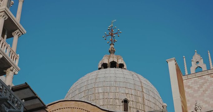 Close up on Cross Symbol top of Venice Cathedral in Italy