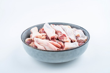 Freshly chopped duck meat on a saucer on white background