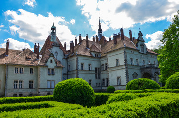 Fototapeta na wymiar Background of Shenborn Castle in the Ukrainian Carpathian Mountains. Castle with green park in the summer season