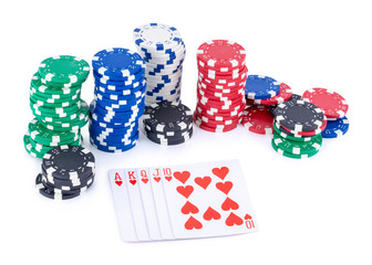 Royal Flush of hearts (highest hand in poker) and stacks of chips isolated on white background with shadow reflection - clipping path.