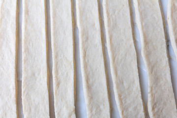 Flat stripes of dough