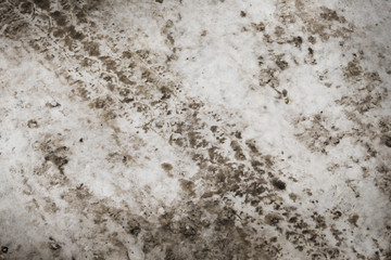 Texture of snow on the road tracks and dirt