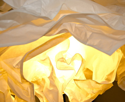 warm and yellow light falls through different layers of paper, light and shadow