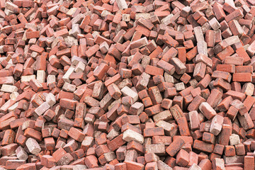 Background of randomly lying red bricks