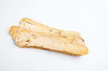 Astragalus medicinal herbs on white background
