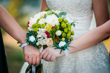 Bouquet of flowerss in the hand of the bride