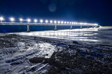 bridge over the river at night in winter
