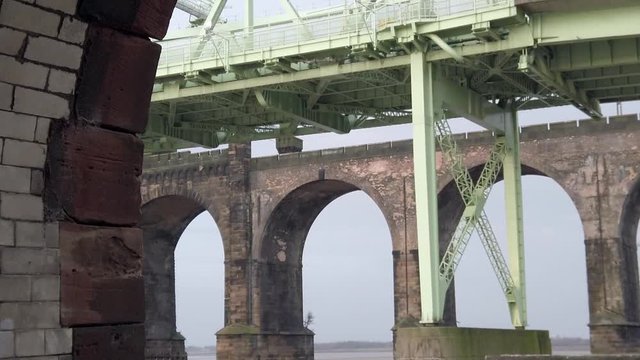 Runcorn silver jubilee bridge & brick archways seen through industrial brick arch, Northwest England.