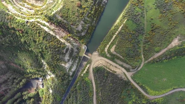 Wide aerial spinning shot, looking down on the Everton Dam in Cyprus.
